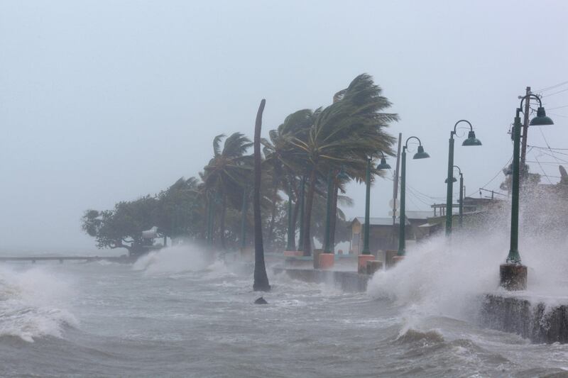 Waves crash against the sea wall in Fajardo, Puerto Rico. Alvin Baez / Reuters