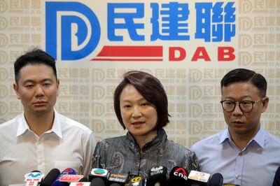 Starry Lee, center, chairperson of pro-Beijing party Democratic Alliance for Betterment of Hong Kong (DAB) speaks at a press conference following her candidates defeat in the local district council election in Hong Kong, Monday, Nov. 25, 2019. The pro-democracy opposition appears to have swept to a resounding victory in Hong Kong elections, as a record turnout dealt a clear rebuke to city leader Carrie Lam and her handling of violent protests that have divided the Chinese territory. (AP Photo/Kin Cheung)