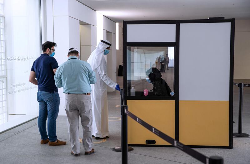 Abu Dhabi, United Arab Emirates, June 25, 2020.   
  Visitors have their tickets  scanned before entering the Louvre , Abu Dhabi, after 100 days of being temporarily closed due to the Covid-19 pandemic.
Victor Besa  / The National
Section:  NA
Reporter:  Saeed Saeed
