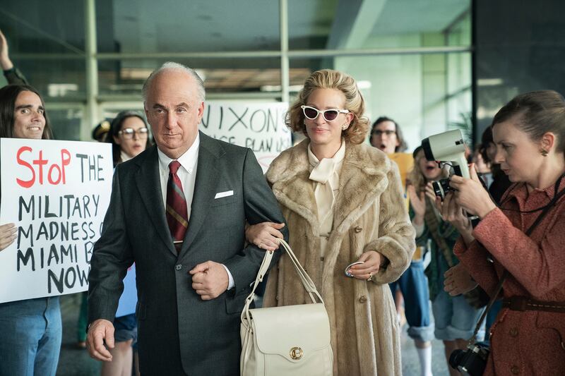 This image released by Starz shows Sean Penn as John Mitchell, left, and Julia Roberts as Martha Mitchell in a scene from "Gaslit," premiering April 24.  (Hilary Bronwyn Gayle / Starz via AP)