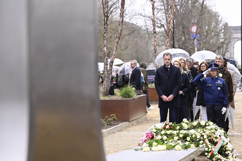 Belgian Prime Minister Alexander De Croo pays his respects at the memorial monument in Brussels to commemorate the 2016 terrorist attacks. AFP