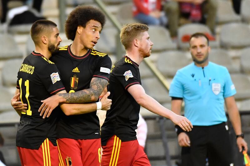 Axel Witsel, second left, celebrates with Belgium teammates after scoring against Poland. AP