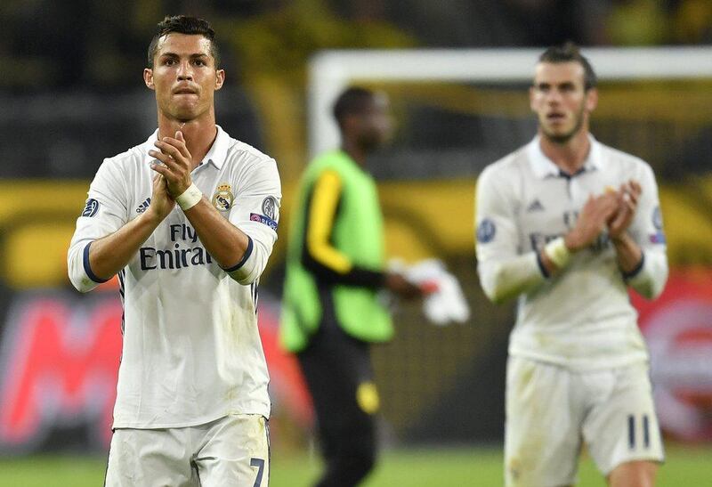 Real Madrid’s Cristiano Ronaldo and Gareth Bale, right, acknowledge the fans after the Champions League Group F match against Borussia Dortmund. Martin Meissner / AP Photo