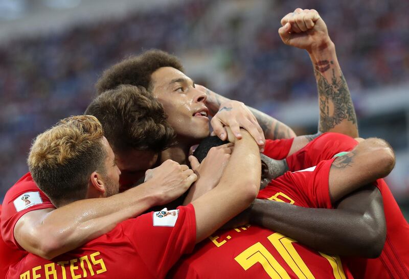 Belgium players celebrate Romelu Lukaku's second goal. Friedemann Vogel / EPA