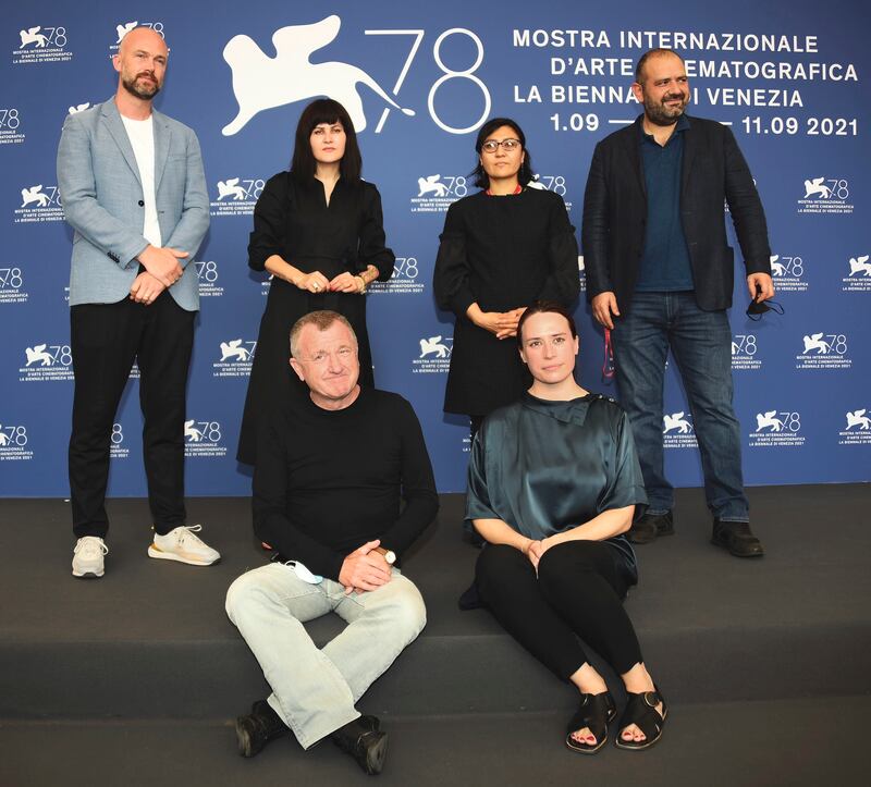 Back row, from left, Matthijs Wouter Knol, Sahraa Karimi, Sarah Mani and Mike Downey, and front row, from left, Orwa Nyrabia and Vanja Kaludjercic during the International Panel on Afghanistan and the situation of Afghan filmmakers and artists at the 78th annual Venice International Film Festival, in Italy. EPA