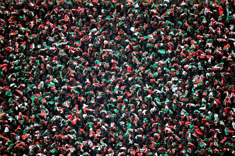 Members of the Mexican Army form a mosaic with national flags during the parade celebrating a new anniversary of the country's independence, at Zocalo Square in Mexico City. Alfredo Estrella/AFP