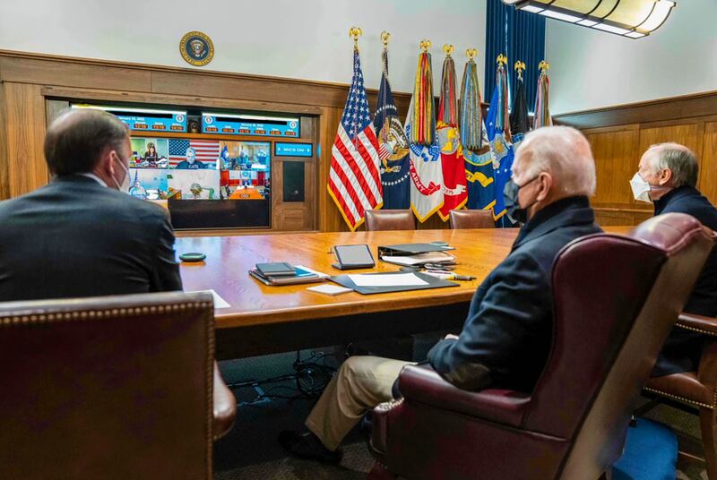 US President Joe Biden, centre, meets online with his national security team and senior officials to discuss Russia's actions towards Ukraine. AP