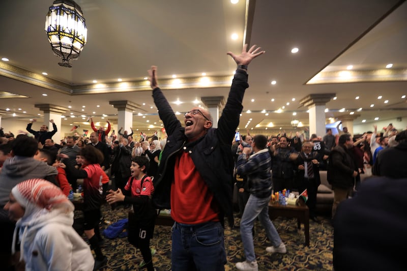 Jordanians celebrate winning the AFC 2023 Asian Cup semi-final between their home team and South Korea, in Amman. All photos: EPA