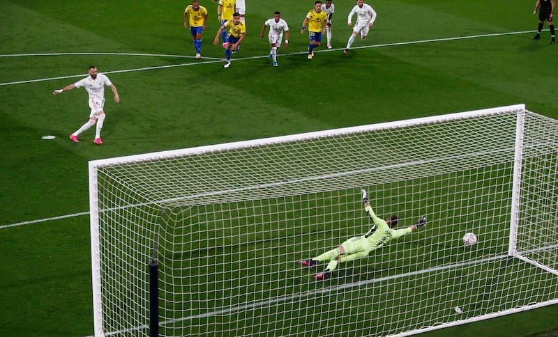 Karim Benzema scores their first goal against Cadiz rom the penalty spot. Reuters