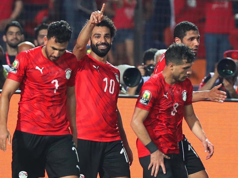 Egypt's 'Trezeguet, left, celebrates with Mohamed Salah after the latter's goal against DR Congo at the 2019 Africa Cup of Nations. EPA