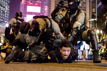 A man is arrested in the Central area of Hong Kong. Rick Findler for The National