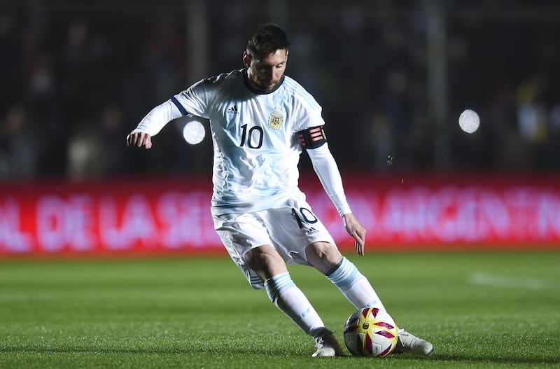 Argentina's Lionel Messi, left, in action against Nicaragua in San Juan, Argentina, on Friday. Marcelo Endelli / Getty Images