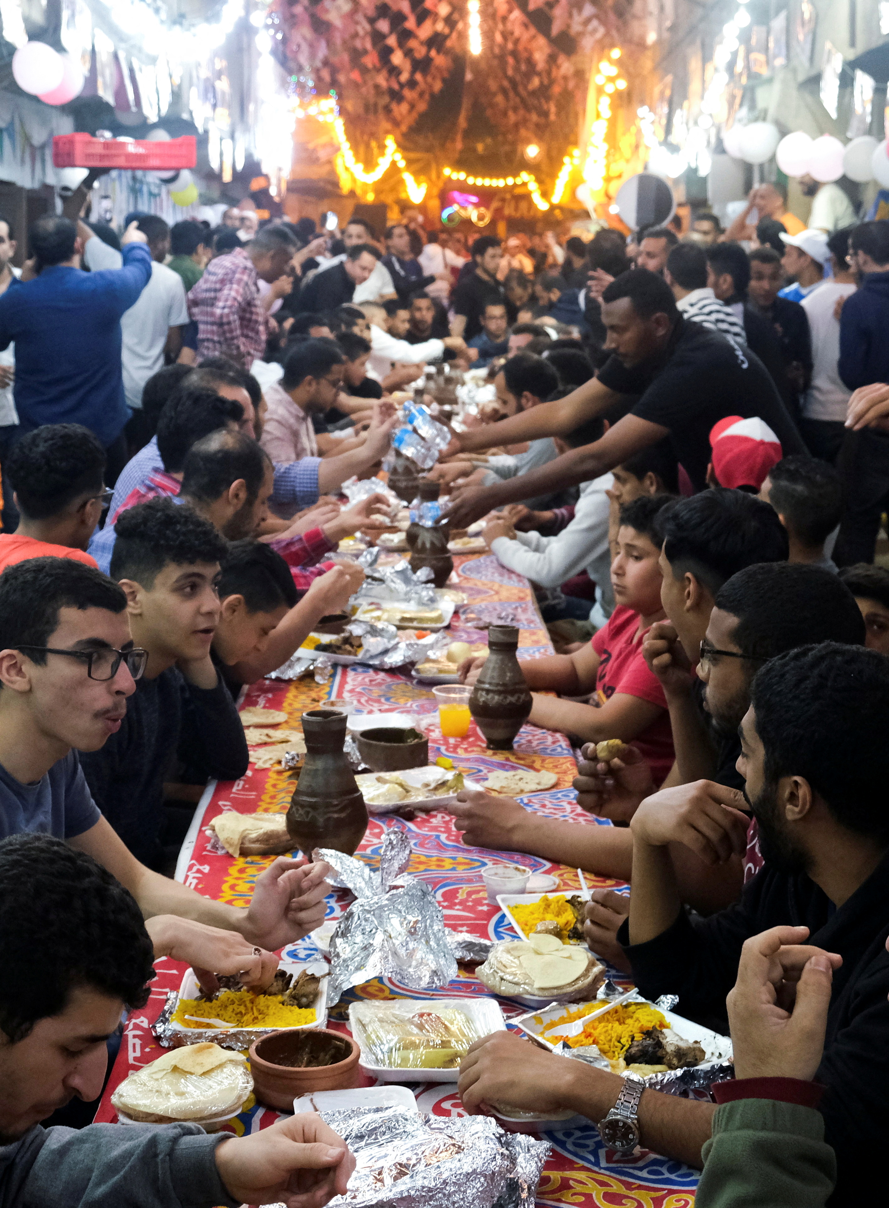 Communal meals have returned to Egypt's streets after being widely suspended for the past two years due to Covid-19 restrictions.