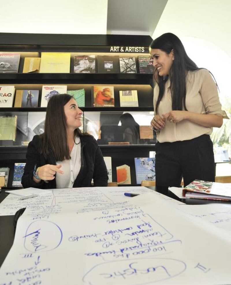 Finalists for the Philadelphia Creativity for a Cause Campaign met their mentors at The Archive in Safa Park in Dubai last month. Mentor Saher Shaikh, right, guides Denisa Fainis. Charles Crowell / The National