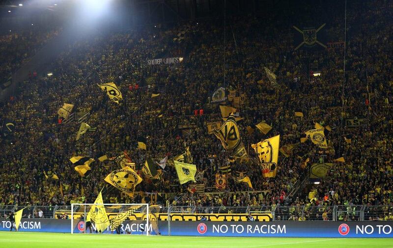 Borussia Dortmund fans show their support prior to the Champions League Group F match against Real Madrid. Dean Mouhtaropoulos / Getty Images