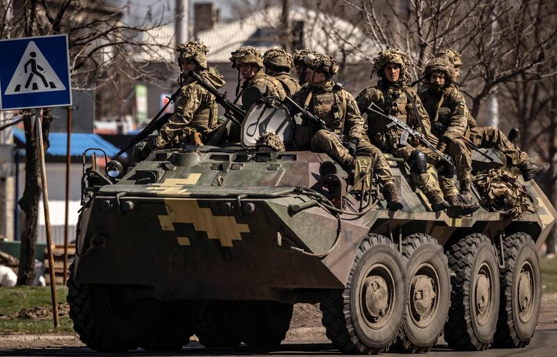 Ukrainian soldiers sit on an armoured vehicle in the city of Severodonetsk, in the Donbas region, on April 7. AFP