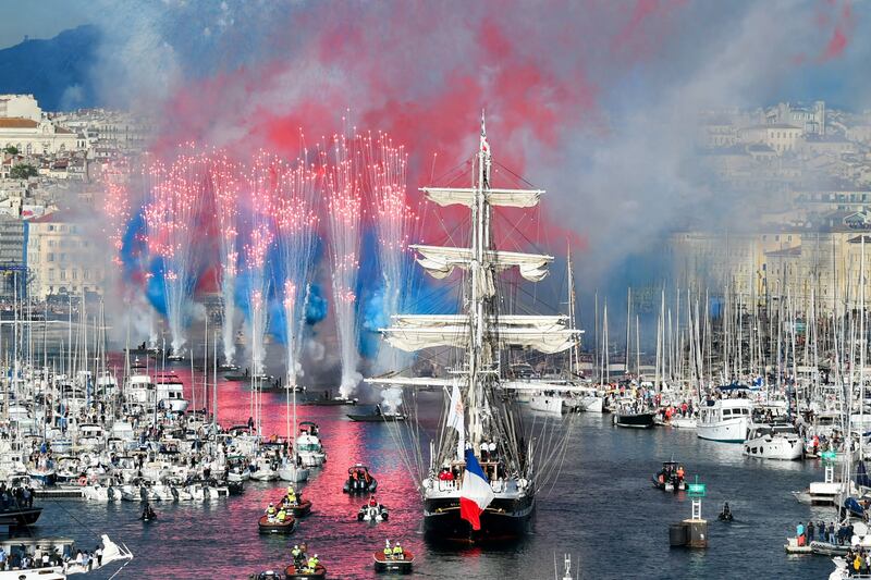 French 19th-century three-masted barque Belem arrives at the Vieux-Port, Marseille carrying the Olympic flame. AFP