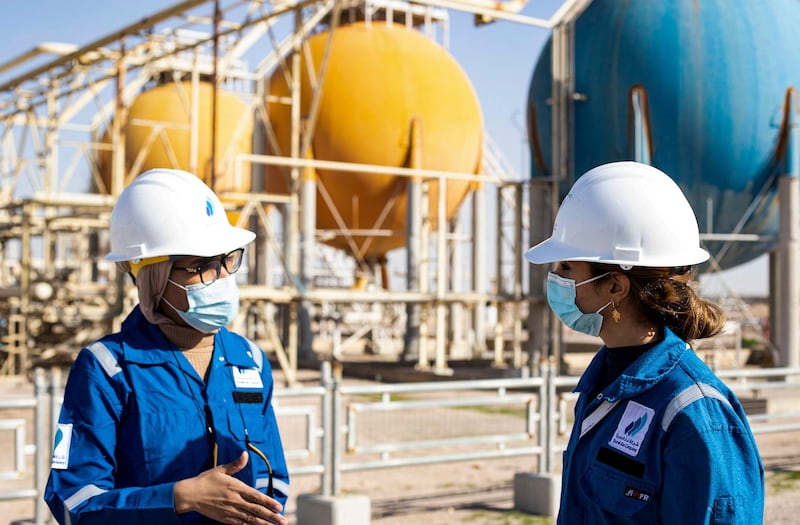 Safa Al Saeedi, 29, right, and  Dalal Abdelamir, 24, two of 180 women among the 5,000 employees at Basrah Gas Company near the southern Iraqi city of Basra. All photos by AFP