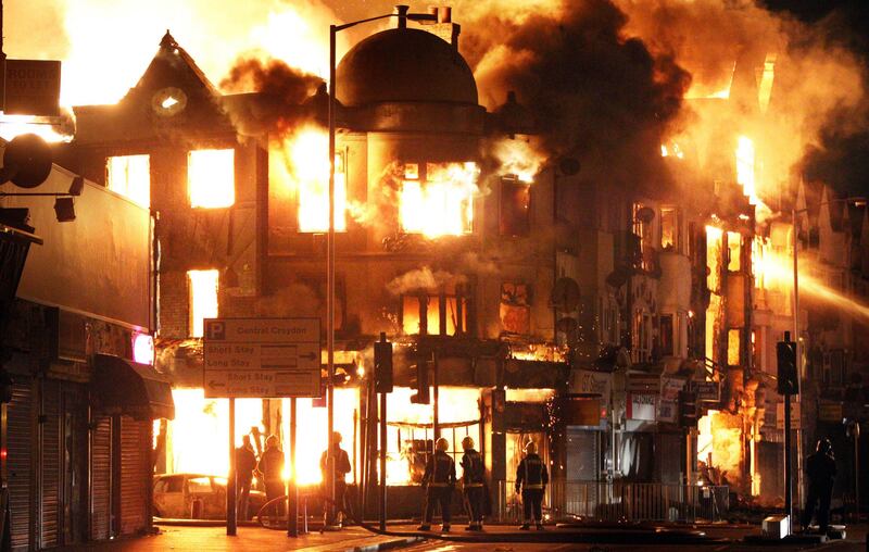 A property is on fire near Reeves Corner in Croydon, south London Tuesday, Aug. 9, 2011. A wave of violence and looting raged across London and spread to three other major British cities on Tuesday, as authorities struggled to contain the country's worst unrest since race riots set the capital ablaze in the 1980s. (AP Photo/PA, Lewis Whyld) UNITED KINGDOM OUT, NO SALES, NO ARCHIVE *** Local Caption ***  Britain Riot.JPEG-0d95c.jpg