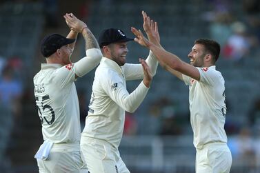 Mark Wood celebrates with Dom Sibley and Ben Stokes after dismissing Anrich Nortje during Day Two. Getty Images