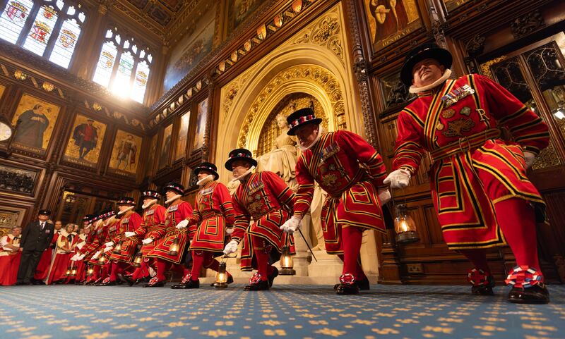 The King's Bodyguard, the Yeomen of the Guard, carry out the traditional ceremonial search in the House of Lords. PA