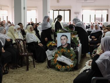 Family members and relatives from the Druze village of Ain Kenia, in the controlled Golan Heights, attend the funeral of Zaher Bishara, 38, who was killed by a Hezbollah rocket launched from south Lebanon and struck an industrial building in the northern Israeli town of Kiryat Shmona. EPA