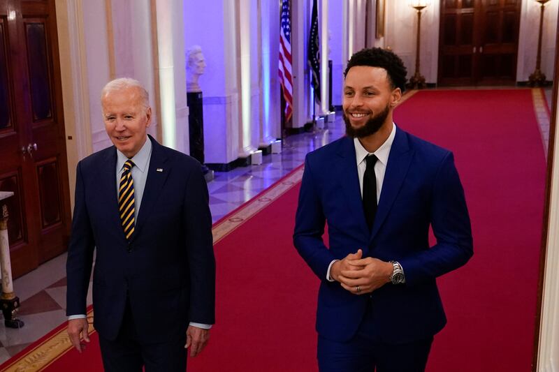 Curry and Mr Biden shared several laughs during the ceremony. AP