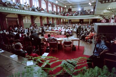 People take part at the opening session of the Truth and Reconciliation Commission on April 15, 1996 at East London. The commission is probing apartheid-era human rights abuses. (Photo by Philip LITTLETON / AFP)