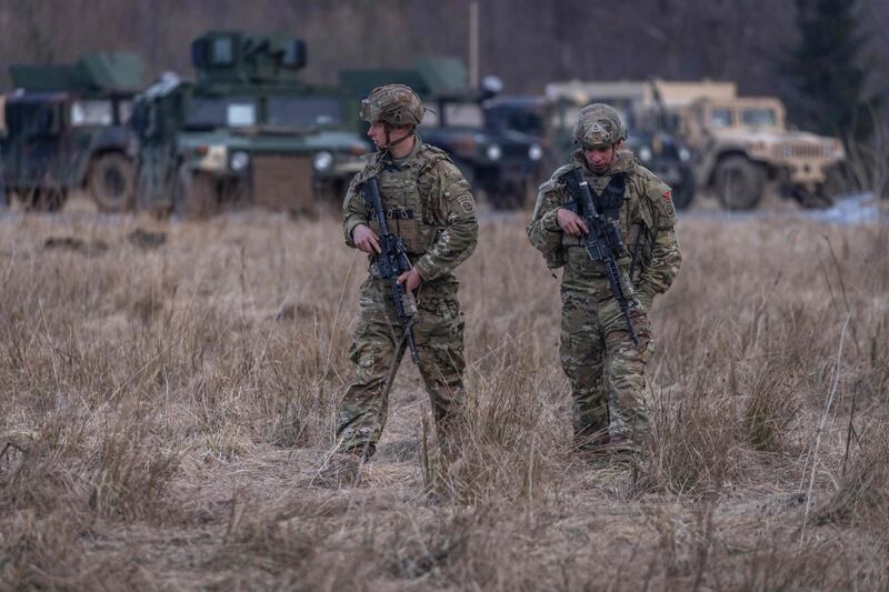 US soldiers on patrol near a military camp in Arlamow, Poland, near the border with Ukraine. AFP