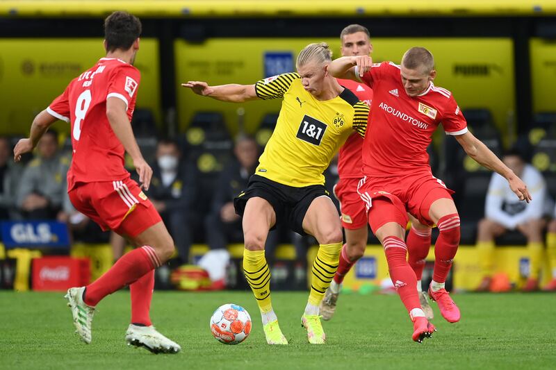 Erling Haaland fights for the ball with Julian Ryerson of Union Berlin. Getty