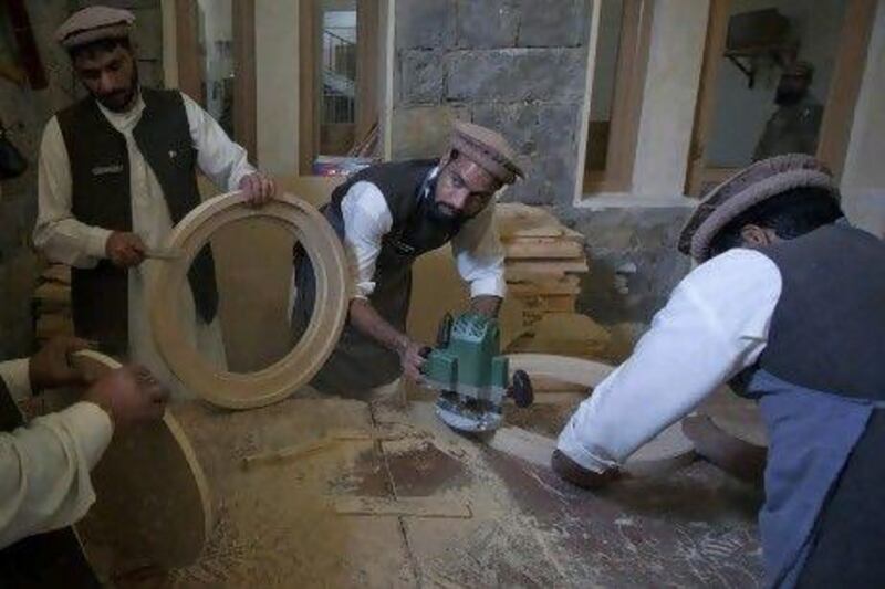 Men make wooden panels in a classroom at the Mashal de-radicalisation centre run by the Pakistani army in Gulibagh in Pakistan's Swat Valley.