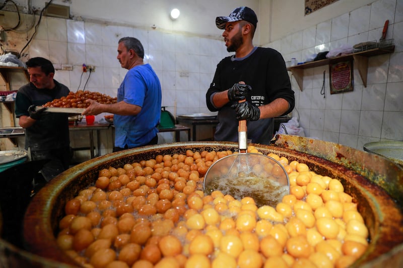 Confectioners prepare traditional sweets for Ramadan in the Sadria district of central Baghdad. AFP