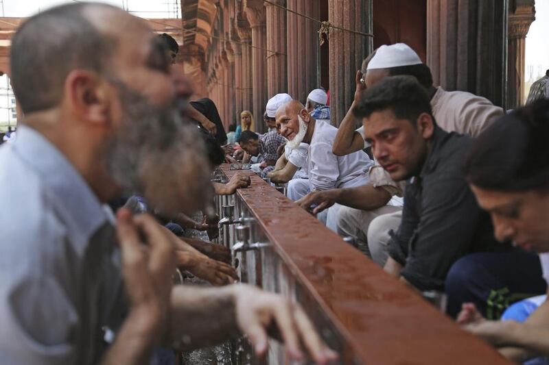Indian Muslims perform ablution before prayers on the first Friday of the holy fasting month of Ramadan at Jama Masjid in New Delhi, India. Altaf Qadri / AP Photo