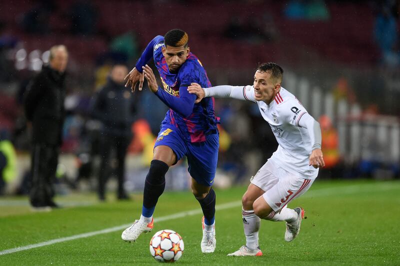 Barcelona's Uruguayan defender Ronald Araujo fights for the ball with Benfica's Spanish defender Alex Grimaldo. AFP