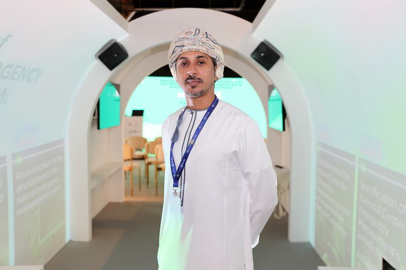 Hamed Al Mamari, from Oman, at his country's pavilion at the Cop28 climate conference at Expo City in Dubai.  Pawan Singh / The National