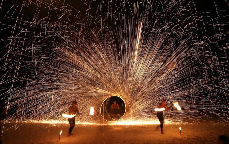 Filipino fire dancers perform for the last time a day before the government implements the temporary closure of the country's most famous beach. Aaron Favila / AP Photo