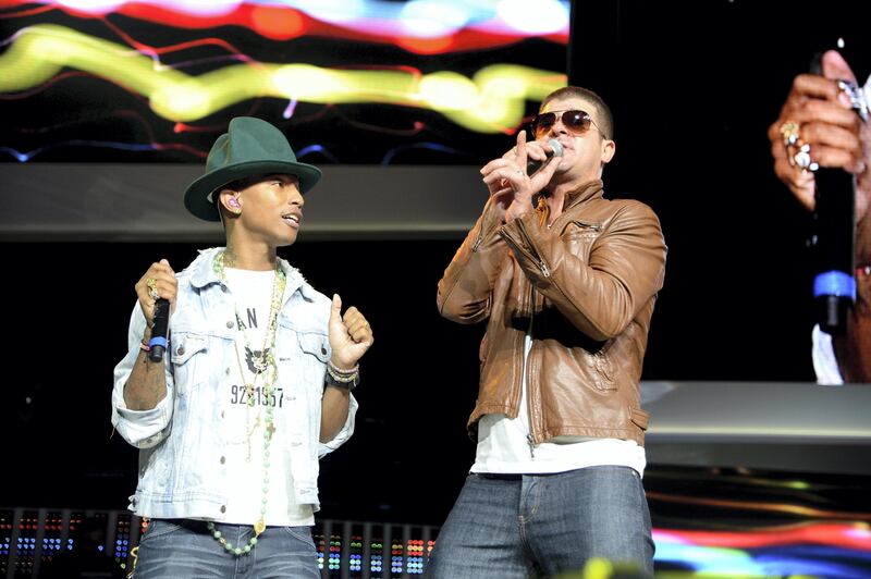 FAYETTEVILLE, AR - JUNE 06:  Pharrell Williams and Robin Thicke perform during the Walmart 2014 annual shareholdersmeeting on June 6, 2014 at Bud Walton Arena at the University of Arkansas in Fayetteville, Arkansas.  (Photo by Jamie McCarthy/Getty Images for Walmart)