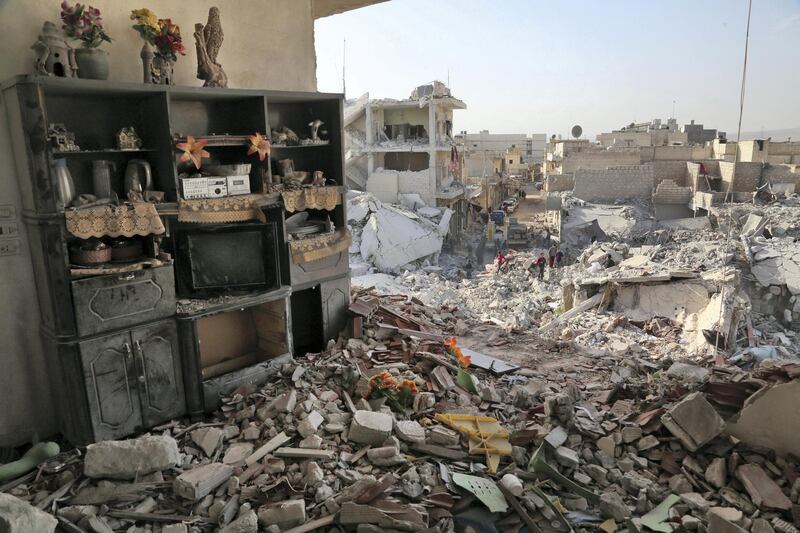 Shelves remain standing amidst the rubble on November 14, 2017 following an air strike the previous day on the northern rebel-held Syrian town of Atareb.
Three strikes hit the northern town of Atareb on Monday, the Syrian Observatory for Human Rights said, despite a "de-escalation zone" in place there. / AFP PHOTO / Zein Al RIFAI