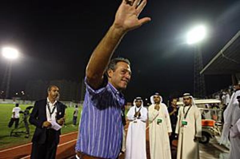 The Al Jazira coach Abel Braga waves to the fans having watched his side win. The result was academic thanks to Al Ahli winning at Al Shabab.