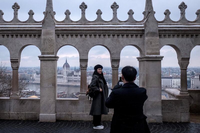 BUDAPEST, HUNGARY - JANUARY 20: Tourists visit the Fisherman's Bastion on January 20, 2019 in Budapest, Hungary. Over the past months thousands of Hungarians have turned out in the streets to call for the resignation of Prime Minister Viktor Orban. Orban was reelected for a third term in April 2018, since taking office Orban, has rebranded his ruling party Fidesz, once a liberal youth party, as a right-wing Christian nationalist organization. After the party‚Äôs victory in 2010, Orban moved to remake Hungary as what he termed ‚Äúan illiberal state.‚Äù Since then, Orban has introduced many changes and new laws to realize this vision: the court system has been stacked with government loyalists; Orban‚Äôs allies have taken control of most Hungarian media; a new labor law - dubbed the ‚Äúslave law‚Äù by critics - has increased the limit on overtime from 250hrs to 400hrs per year; the ‚ÄúStop Soros‚Äù bill targeted NGOs and individuals assisting refugees and migrants; accreditation laws for foreign universities were changed, forcing the renowned Central European University to move most operations to Vienna; and a new homeless law that criminalizes sleeping on the streets. Mr. Orban‚Äôs moves have created a template for his brand of illiberal democracy, which is providing inspiration to far-right and populist leaders in Poland, Italy, France, Netherlands and Brazil.  (Photo by Chris McGrath/Getty Images)