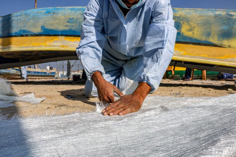 A craftsman at work on a boat