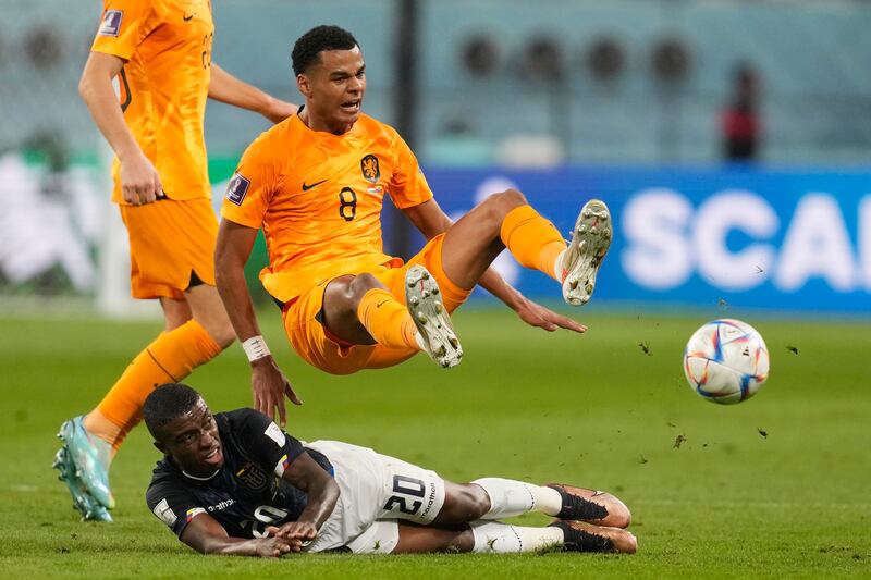 Cody Gakpo and Ecuador's Jhegson Mendez challenge for the ball. AP