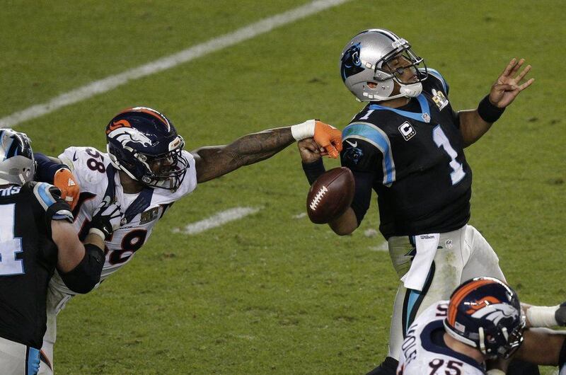 Denver's Von Miller strips the ball from Carolina's Cam Newton during the second half of Super Bowl 50 in Santa Clara, Calif. (AP Photo/Charlie Riedel) 