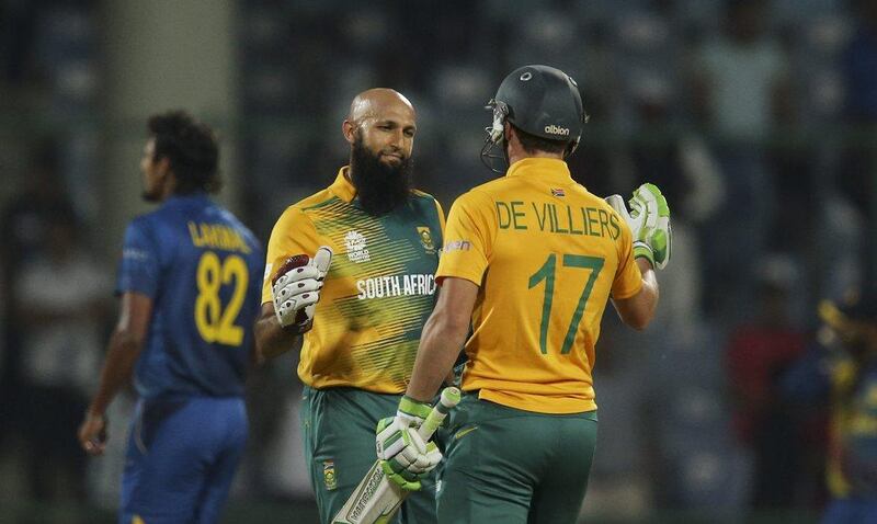 Hashim Amla, left, and AB De Villiers, celebrate South Africa's victory over Sri Lanka. Manish Swarup / AP Photo