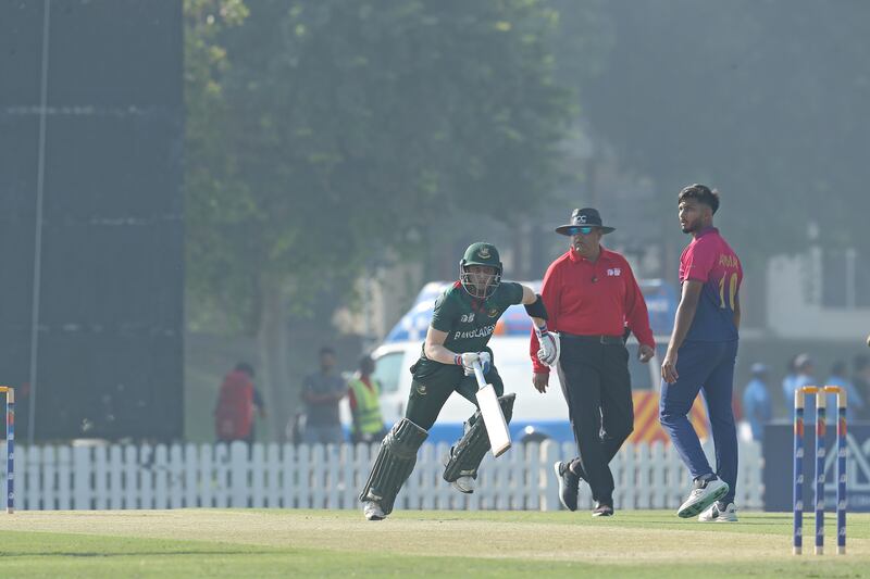 Jishan Alam of Bangladesh runs between the wickets on his way to a score of 42 against the UAE.
