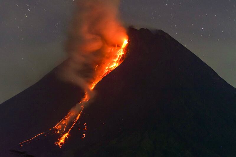 The Mount Merapi volcano spews lava as seen from Sleman in Yogyakarta, Indonesia. AFP
