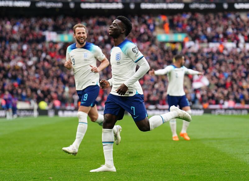 England's Bukayo Saka celebrates scoring the second goal  with Harry Kane. PA