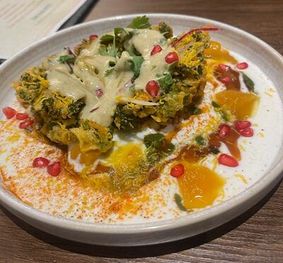 The crispy kale dish features vibrant flavours and colours on a plate. One Carlo Diaz / The National