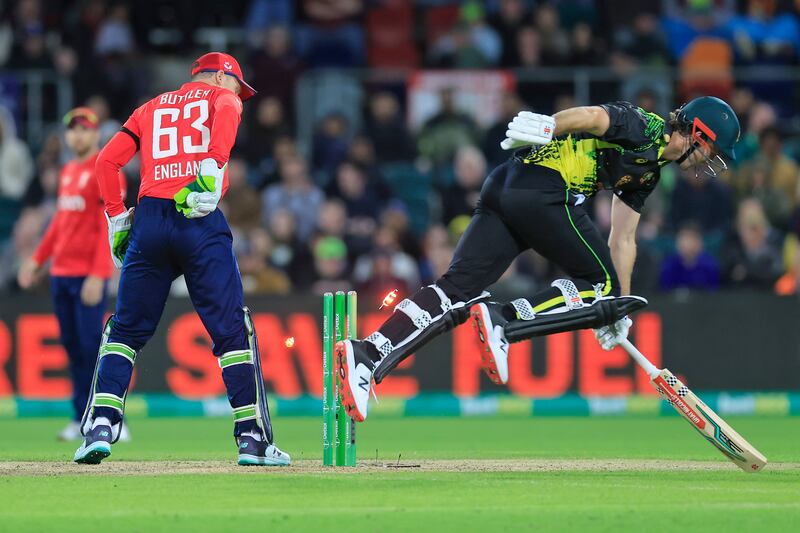 Mitchell Marsh of Australia makes it back to the crease as Jos Buttler attempts a run out. Getty