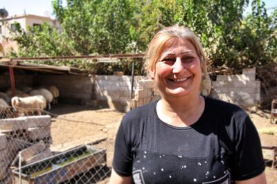 Mother-of-five Rania AlOfair has learned how to run the farm and is ensuring is thrives thanks to hydroponic technology. Photo by Charlie Faulkner